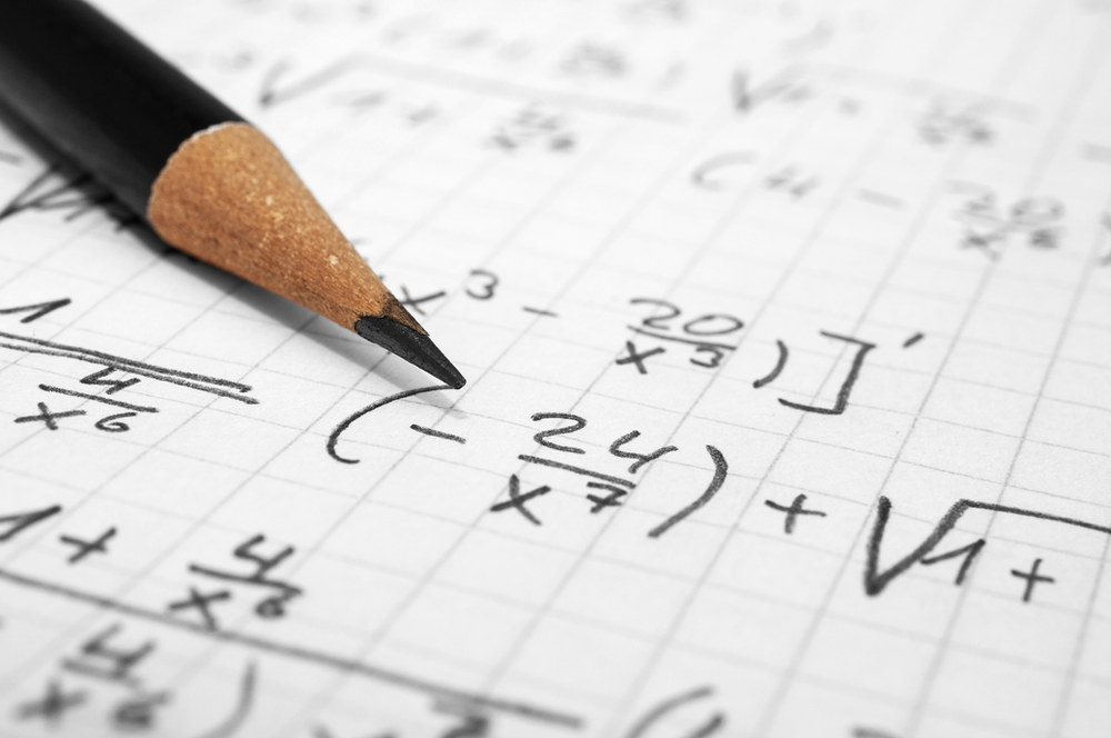 Mathematical formulas written on a chalkboard